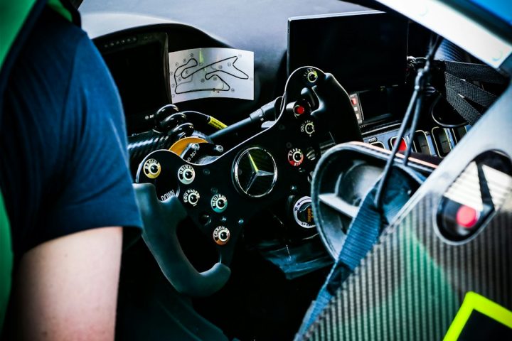 a close up of a steering wheel in a race car
